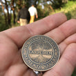 Load image into Gallery viewer, Carpe Diem Coin - Antique Bronze outdoors
